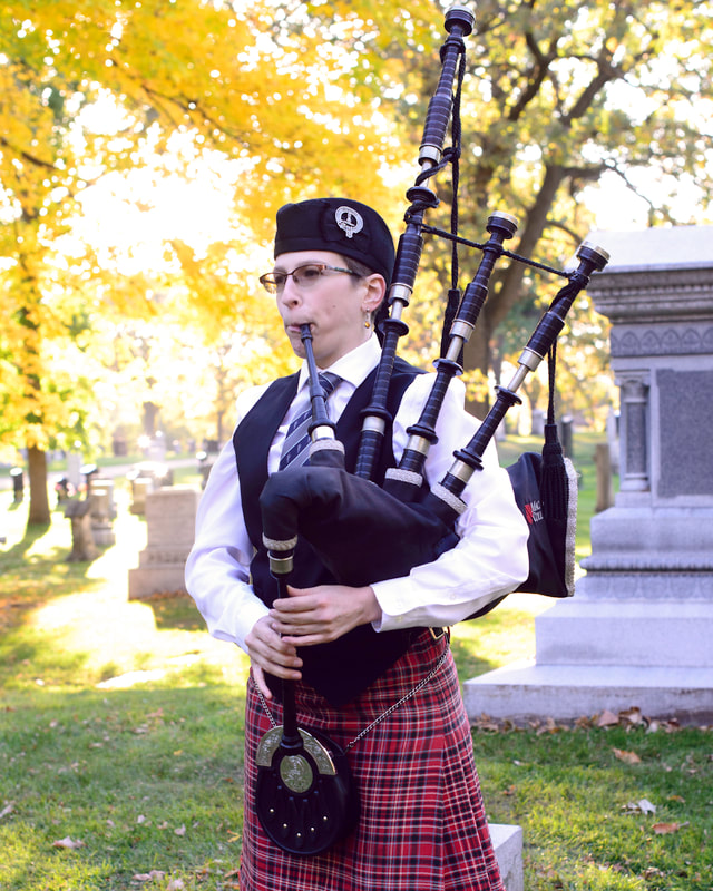 Playing a bagpipe funeral song