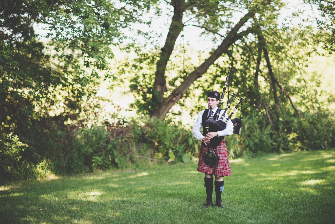 Bagpiping before a wedding ceremony as guess arrive at Bloom Lake Barn, Shafer, MN.